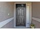 Close up of the front door featuring a secure lock and sidelight at 4175 Horseshoe Ave, North Port, FL 34286