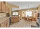 Bright kitchen and breakfast nook with tiled flooring, stainless steel appliances, and lots of natural light at 4175 Horseshoe Ave, North Port, FL 34286