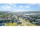 An aerial view captures the home nestled in a neighborhood with easy access to the river and bay at 4254 Bur St, Port Charlotte, FL 33948
