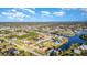 Wide aerial view displaying waterfront homes and boats along the canal at 4254 Bur St, Port Charlotte, FL 33948