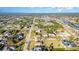 Neighborhood aerial view showing homes, streets, canals and lush landscaping at 4254 Bur St, Port Charlotte, FL 33948