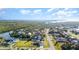 An aerial view captures the home nestled in a neighborhood with easy access to the river and bay at 4254 Bur St, Port Charlotte, FL 33948
