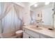 Cozy bathroom featuring a tub and shower combination, vanity, and ample lighting at 4254 Bur St, Port Charlotte, FL 33948