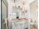 Classic bathroom featuring dual pendant lighting, a vanity with storage, and a shower stall at 4254 Bur St, Port Charlotte, FL 33948
