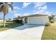Beautifully maintained one-story home featuring an attached garage and extended driveway at 4254 Bur St, Port Charlotte, FL 33948
