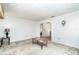 Spacious living room featuring neutral carpet, a large window, and a ceiling fan at 4254 Bur St, Port Charlotte, FL 33948