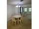 Cozy dining room featuring a round table with classic chairs near living area at 432 Olivia Rd, Venice, FL 34293