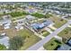Wide aerial shot displaying a residential neighborhood with houses near a waterway at 530 Lakemont Nw Ave, Port Charlotte, FL 33952