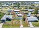 Aerial view showcasing the property's boundaries, pool, outbuilding, and its location within the neighborhood at 530 Lakemont Nw Ave, Port Charlotte, FL 33952