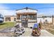 Outdoor entertainment area with a cozy screened shed, fireplace, and comfortable seating at 530 Lakemont Nw Ave, Port Charlotte, FL 33952