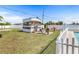 The backyard has a shed, sitting area, and vinyl privacy fence at 530 Lakemont Nw Ave, Port Charlotte, FL 33952
