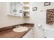 Well-lit bathroom with a single sink vanity and ample storage at 530 Lakemont Nw Ave, Port Charlotte, FL 33952