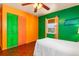 Bedroom with hardwood floors, ceiling fan, and lots of natural light at 530 Lakemont Nw Ave, Port Charlotte, FL 33952