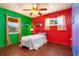 Bedroom with hardwood floors, ceiling fan, and lots of natural light at 530 Lakemont Nw Ave, Port Charlotte, FL 33952