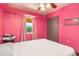 Bedroom features hardwood floors, ceiling fan and natural light at 530 Lakemont Nw Ave, Port Charlotte, FL 33952