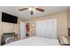 Bedroom with a ceiling fan, closet, and tv at 530 Lakemont Nw Ave, Port Charlotte, FL 33952