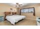 Comfortable bedroom with carpet flooring, a ceiling fan, and ample natural light at 530 Lakemont Nw Ave, Port Charlotte, FL 33952