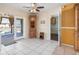 Dining area adjacent to the kitchen, offering access to outdoor patio and showcasing a built-in cabinet at 530 Lakemont Nw Ave, Port Charlotte, FL 33952