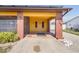Welcoming front porch with brick pillars and space for outdoor seating at 530 Lakemont Nw Ave, Port Charlotte, FL 33952