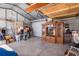 A spacious garage interior with cabinets, storage, and a roll-up door at 530 Lakemont Nw Ave, Port Charlotte, FL 33952