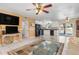 Bright living area with tile floors, a ceiling fan, seamless kitchen access and TV viewing at 530 Lakemont Nw Ave, Port Charlotte, FL 33952