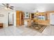 Spacious living room featuring tile floors, bright walls, and a ceiling fan at 530 Lakemont Nw Ave, Port Charlotte, FL 33952