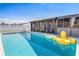 The backyard features an inground pool, and screened in patio at 530 Lakemont Nw Ave, Port Charlotte, FL 33952