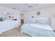 Spacious bedroom with modern white furniture, soft carpet, and a serene atmosphere at 6171 Swiss Blvd, Punta Gorda, FL 33982