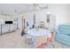 Open dining area featuring vaulted ceiling, tile floors, and a table set for four, adjacent to the living area at 6171 Swiss Blvd, Punta Gorda, FL 33982