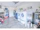 Well-equipped garage with washer, dryer, water heater, and storage shelves at 6171 Swiss Blvd, Punta Gorda, FL 33982