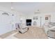 Cozy living room with plush carpeting, a large window, and neutral décor, creating a relaxing atmosphere at 6171 Swiss Blvd, Punta Gorda, FL 33982