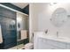 Modern bathroom featuring blue subway tile in the shower and a white vanity at 6251 Cassia St, Bradenton, FL 34203