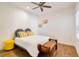 Cozy bedroom with wood-look tile, bright natural light and decorative accents at 6251 Cassia St, Bradenton, FL 34203