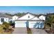 Charming villa boasts two-car garage and manicured landscaping, adding to its curb appeal at 6251 Cassia St, Bradenton, FL 34203