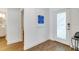 Bright hallway featuring wood-look tile and a decorative front door at 6251 Cassia St, Bradenton, FL 34203
