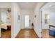 Hallway leading to bedroom and office, with decorative artwork at 6251 Cassia St, Bradenton, FL 34203