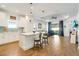 Open-concept kitchen featuring a center island, breakfast bar, seamlessly connected to the living area at 6251 Cassia St, Bradenton, FL 34203
