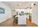 Beautiful kitchen with white cabinetry, stainless steel appliances, center island, and stylish barstool seating at 6251 Cassia St, Bradenton, FL 34203