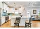 Kitchen featuring a center island with barstool seating, stainless steel appliances and an open floor plan at 6251 Cassia St, Bradenton, FL 34203