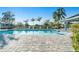 Relaxing pool area featuring lounge chairs and swaying palm trees, perfect for enjoying sunny days at 6251 Cassia St, Bradenton, FL 34203