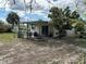 Backyard with patio and shed, offering extra space at 761 Dalton Blvd, Port Charlotte, FL 33952