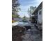 Backyard featuring a swimming pool, deck, and partial view of the house at 8152 Robert St, Englewood, FL 34224
