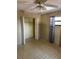 A bedroom with patterned flooring and a closet at 8152 Robert St, Englewood, FL 34224