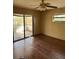 An empty bedroom with a sliding glass door that leads to a deck at 8152 Robert St, Englewood, FL 34224
