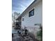 Exterior view of home with siding, showing access to screened porch at 8152 Robert St, Englewood, FL 34224