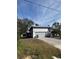 Single story home with an attached garage and driveway at 8152 Robert St, Englewood, FL 34224