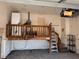 View of interior garage with water heater and partial mezzanine at 8152 Robert St, Englewood, FL 34224
