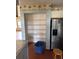 Kitchen pantry with wire shelving and stainless steel refrigerator at 8152 Robert St, Englewood, FL 34224