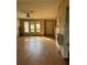 View of the living room with wood floor and light yellow paint at 8152 Robert St, Englewood, FL 34224