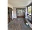 Enclosed porch with screens and a sliding glass door at 8152 Robert St, Englewood, FL 34224